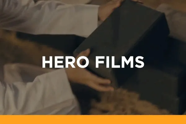 Hero films — showreel on Vimeo. A woman smiling against a leafy green backdrop.